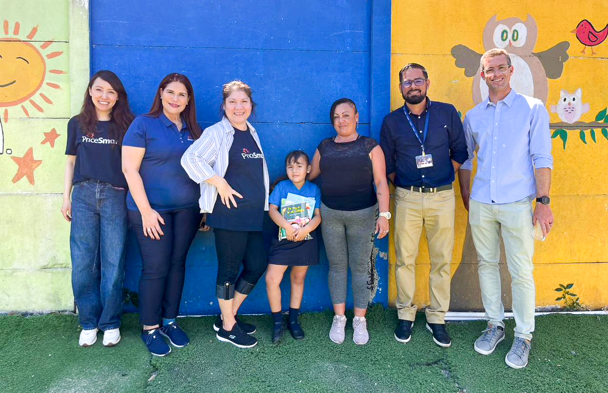 PriceSmart Foundation president, David Price, and PriceSmart employees at a school in San Jose, Costa Rica